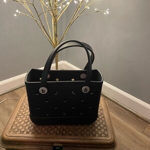 Bogg bitty bag, the tote has charms included